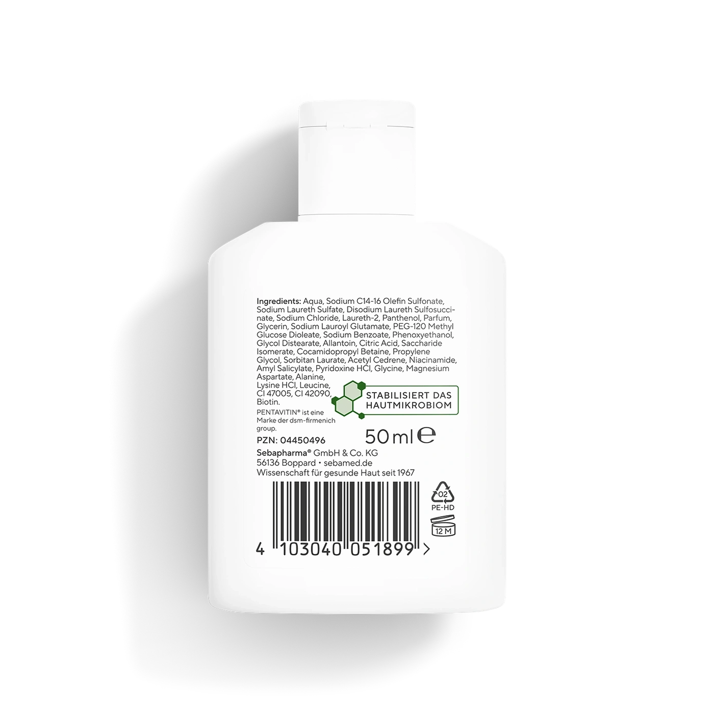 Ein weißer Flakon mit einem Etikett, das Inhaltsstoffe und Produktinformationen auflistet.