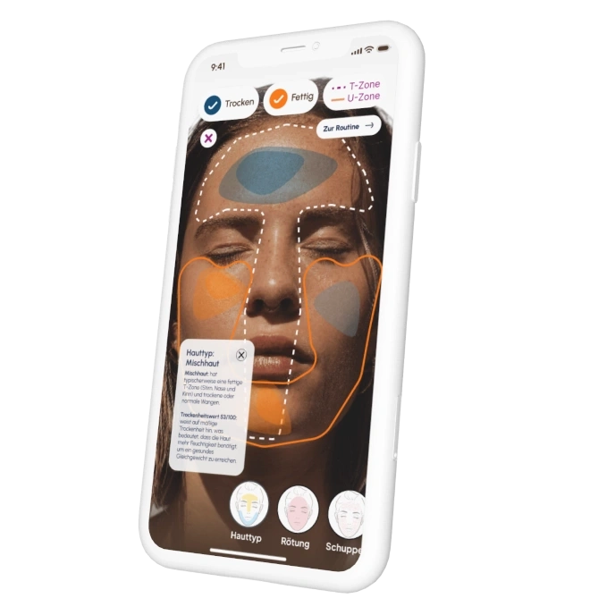 Eine Hautanalyse-App auf einem Smartphone zeigt verschiedene Hautzonen und Hauttypen.