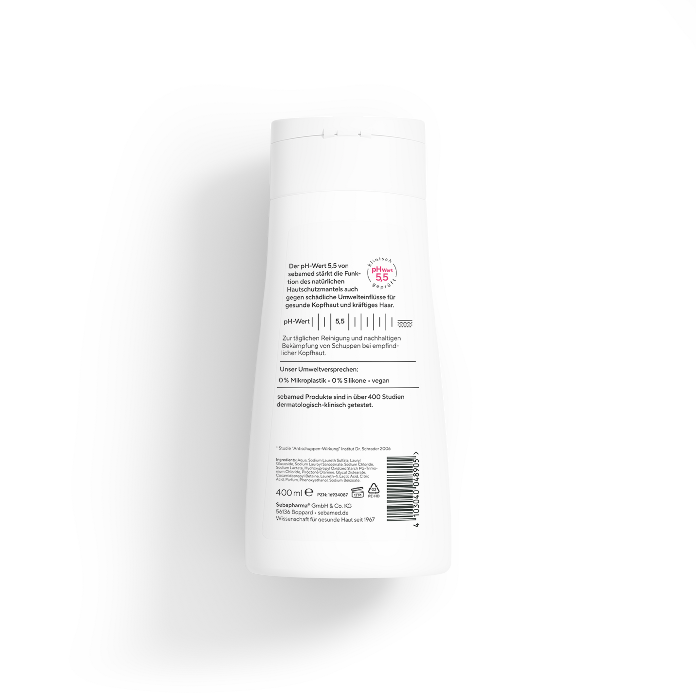 Eine weiße Flasche mit Text, die ein Shampoo für empfindliche Kopfhaut bewirbt.
