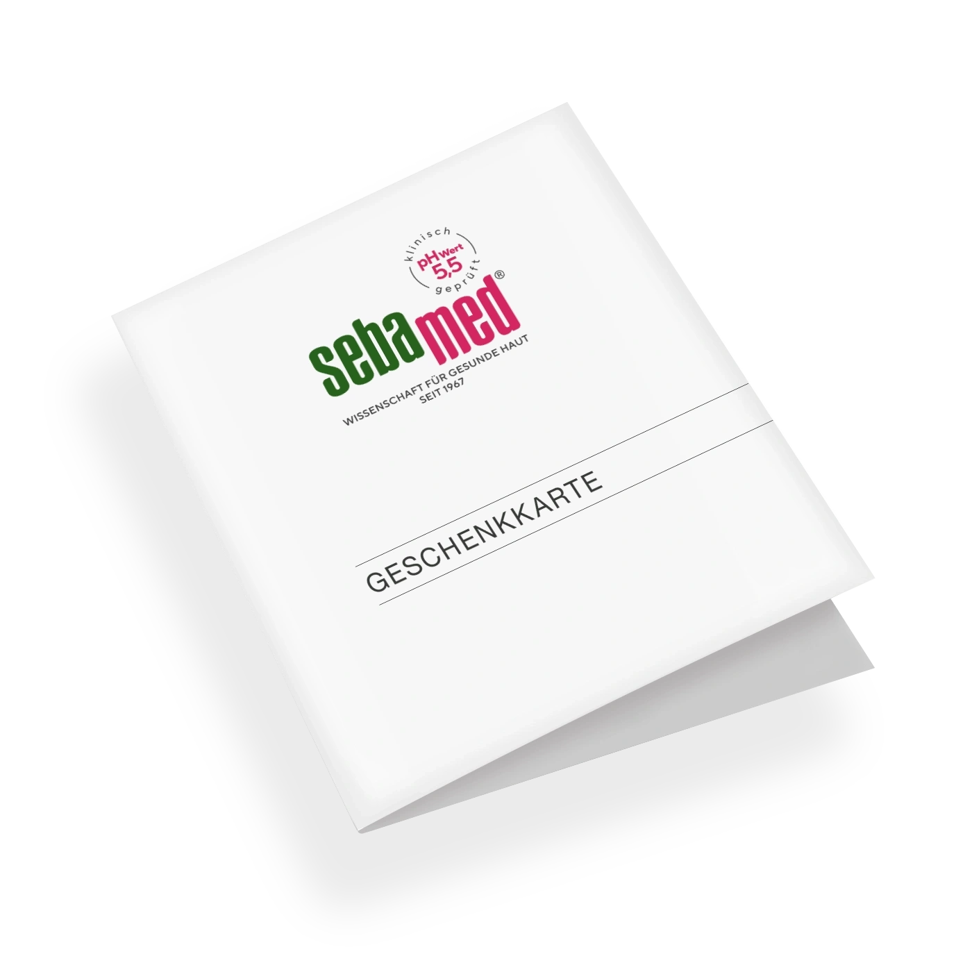 Eine Geschenkkarte von Sebamed, die auf einem schwarzen Hintergrund liegt.